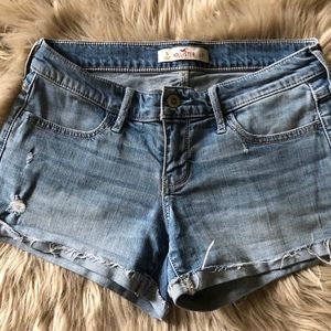 Hollister light blue jean shorts cuffed.